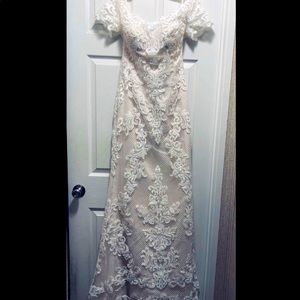Wedding dress never worn still in the David’s bridal bag.